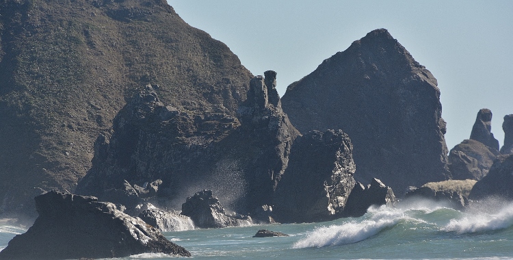 rugged rock formations in water 